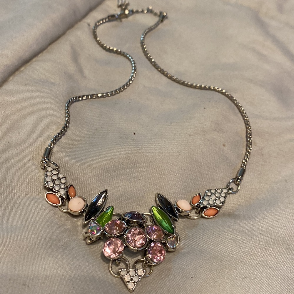 16” silver plated chain holds this awesome bib. $15.00 - Picture 2 of 4
